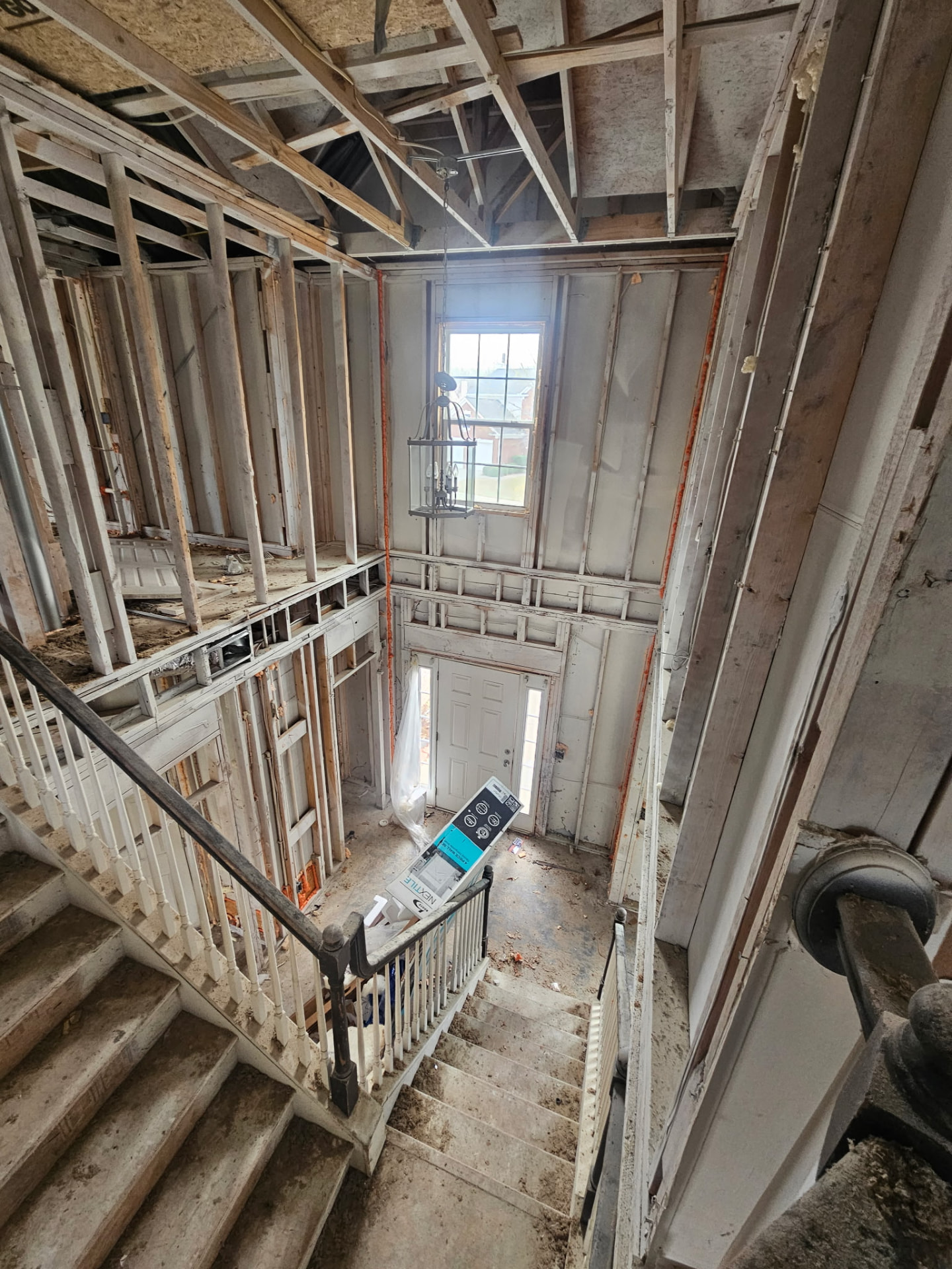 Two-story entry stripped to the studs during a full interior demolition by LV Remodeling & Construction